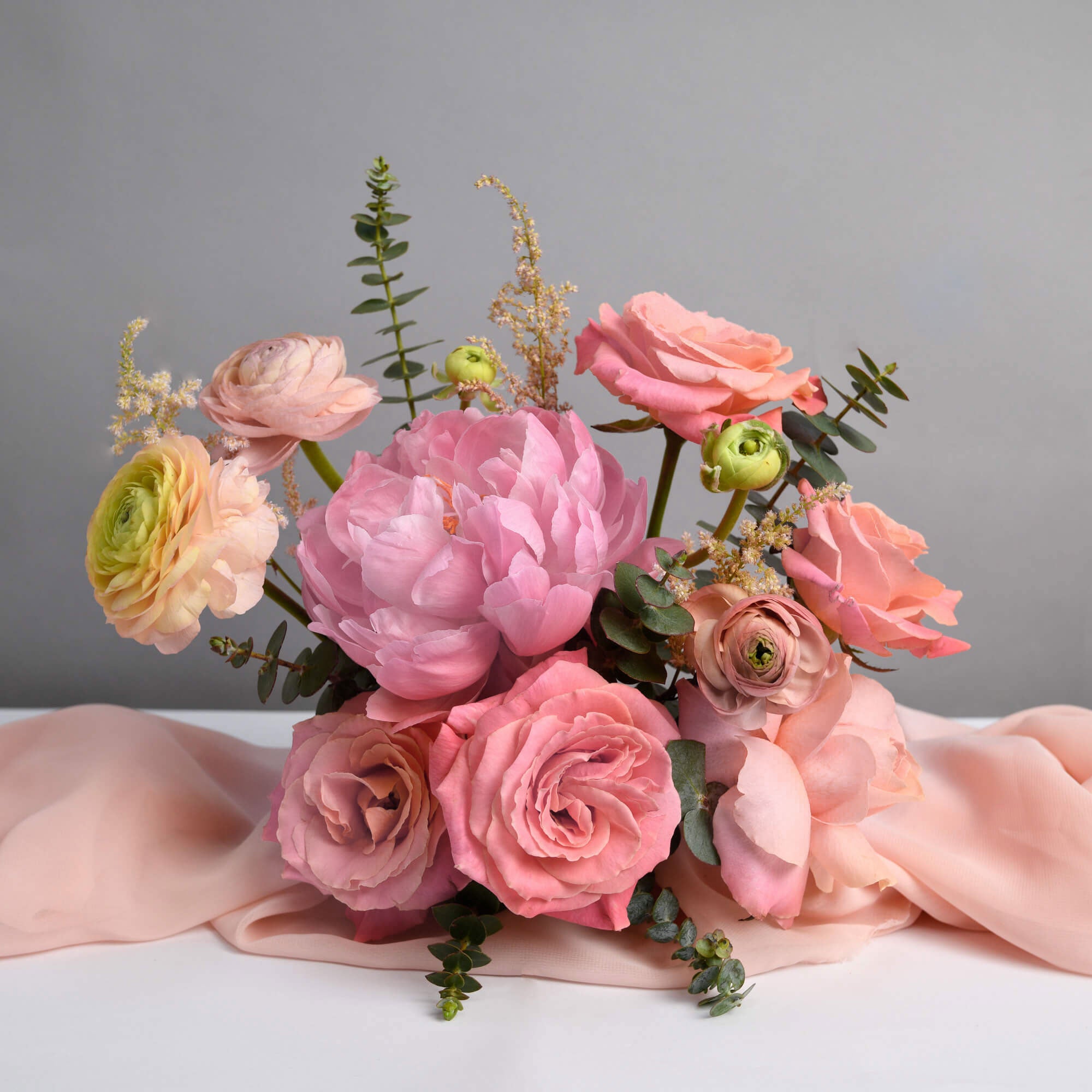 Table arrangement with peonies and roses