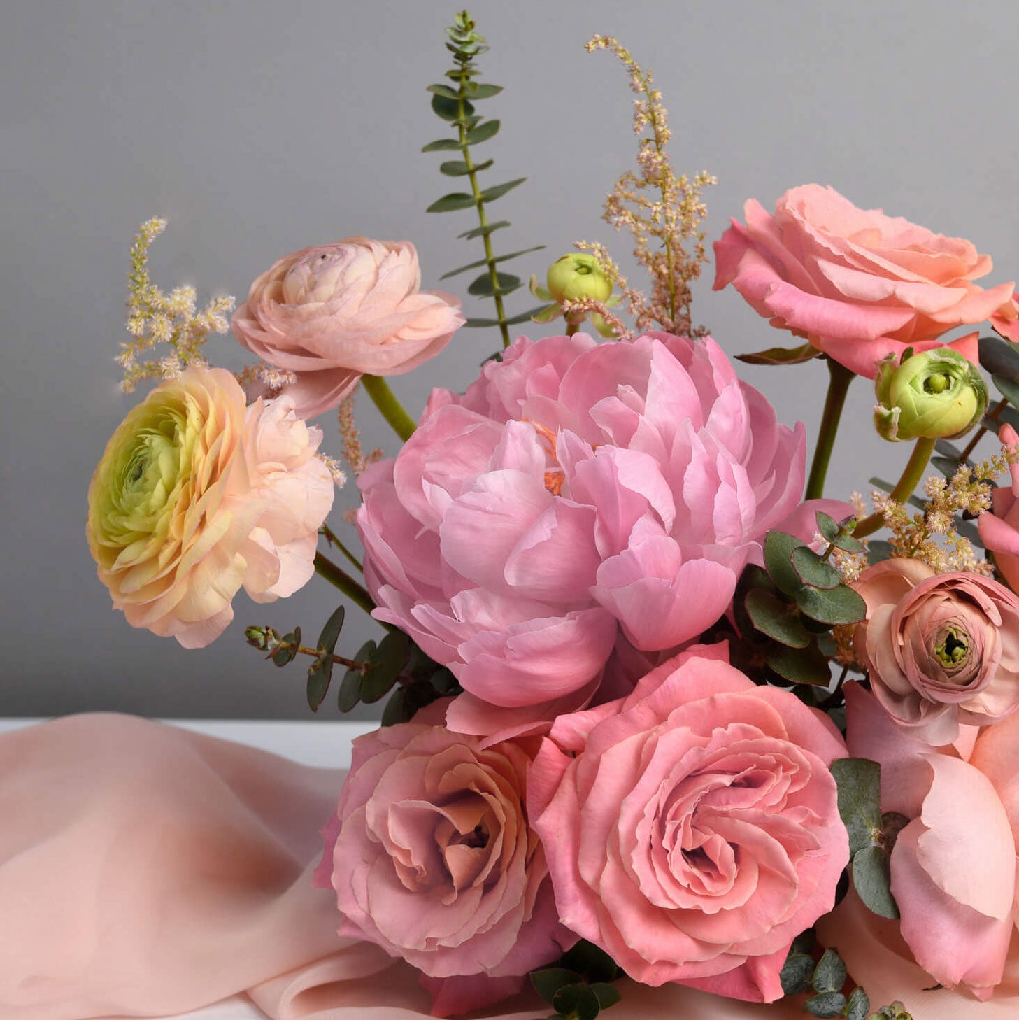 Table arrangement with peonies and roses