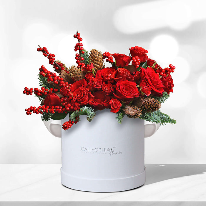 White box with red roses and fir tree