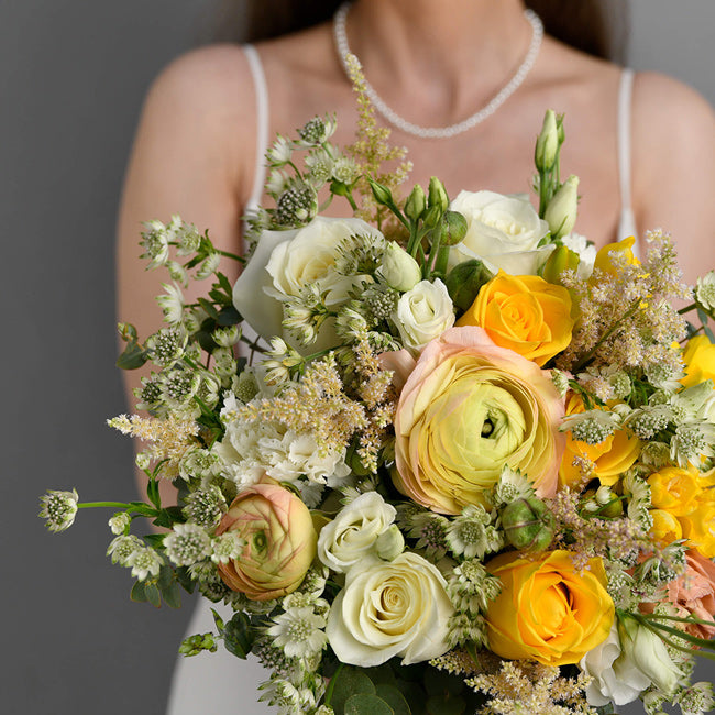 Bridal bouquet with yellow roses and astilbe