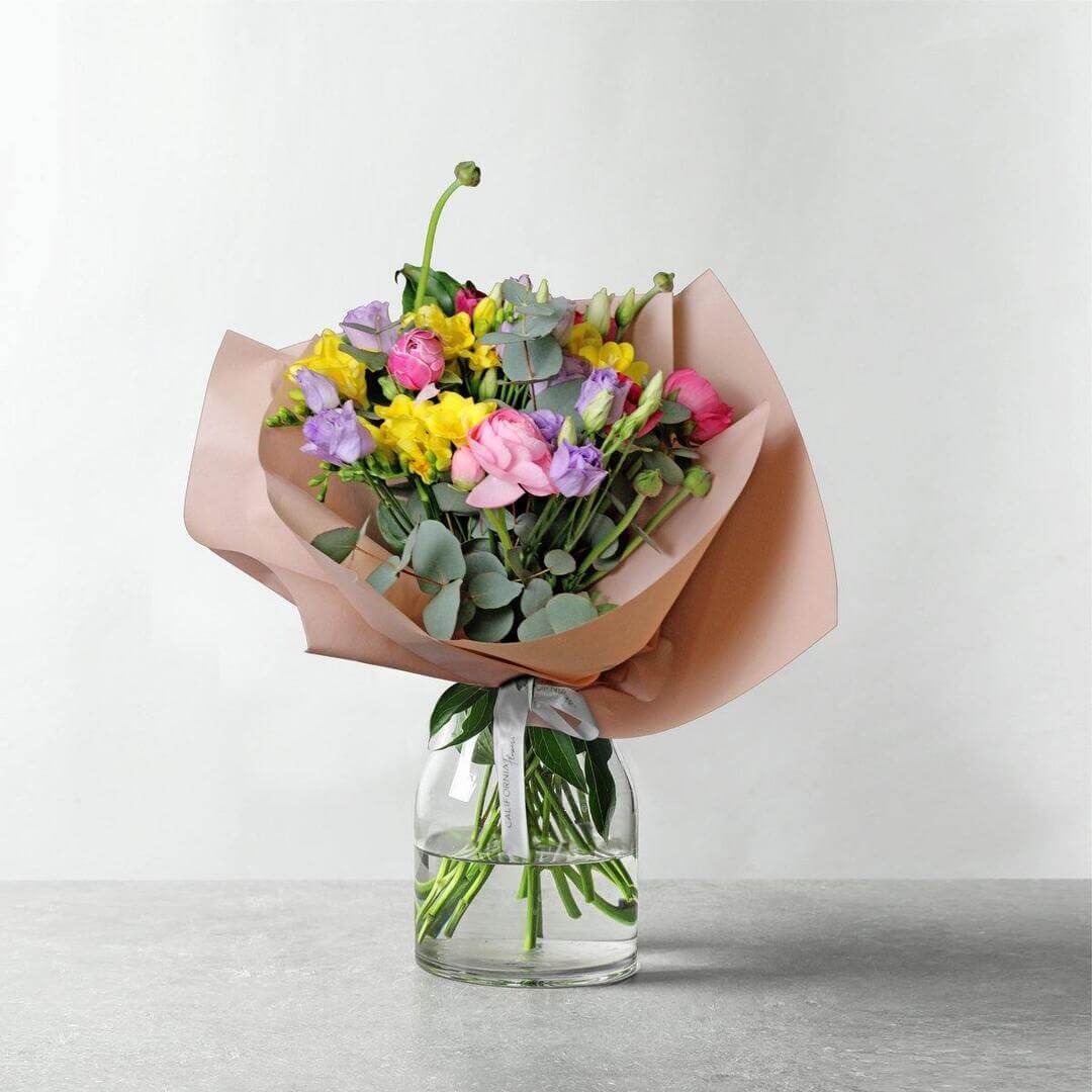 Bouquet with ranunculus, freesia and lisianthus