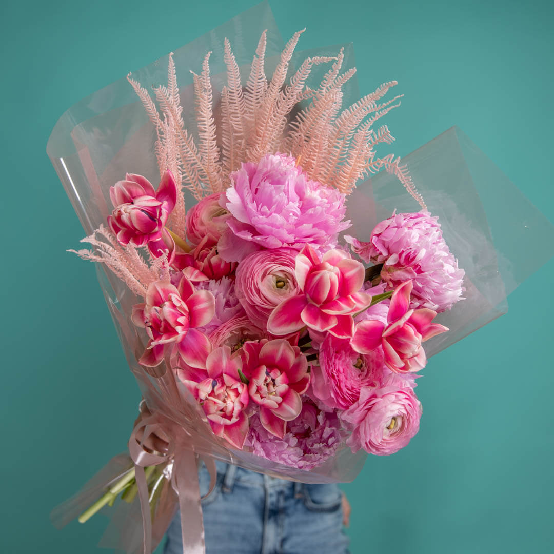 Bouquet with ranunculus, peonies and tulips
