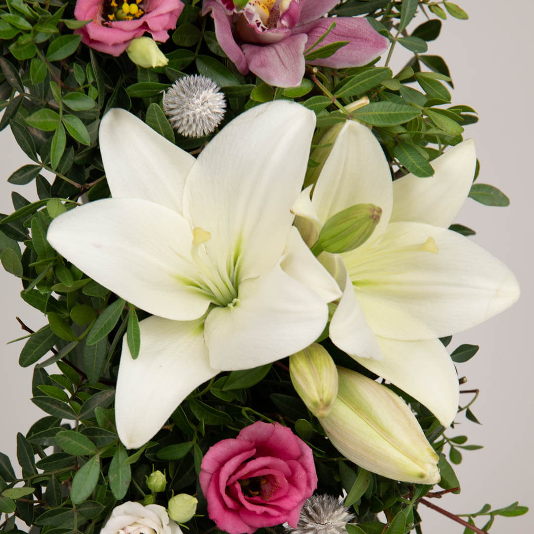 Funeral wreath with lilies and purple cymbidium