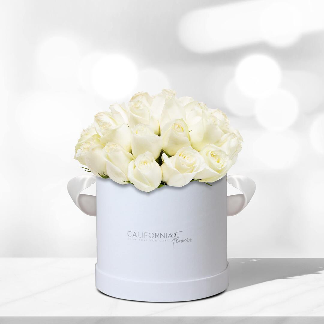 White box with 21 white roses