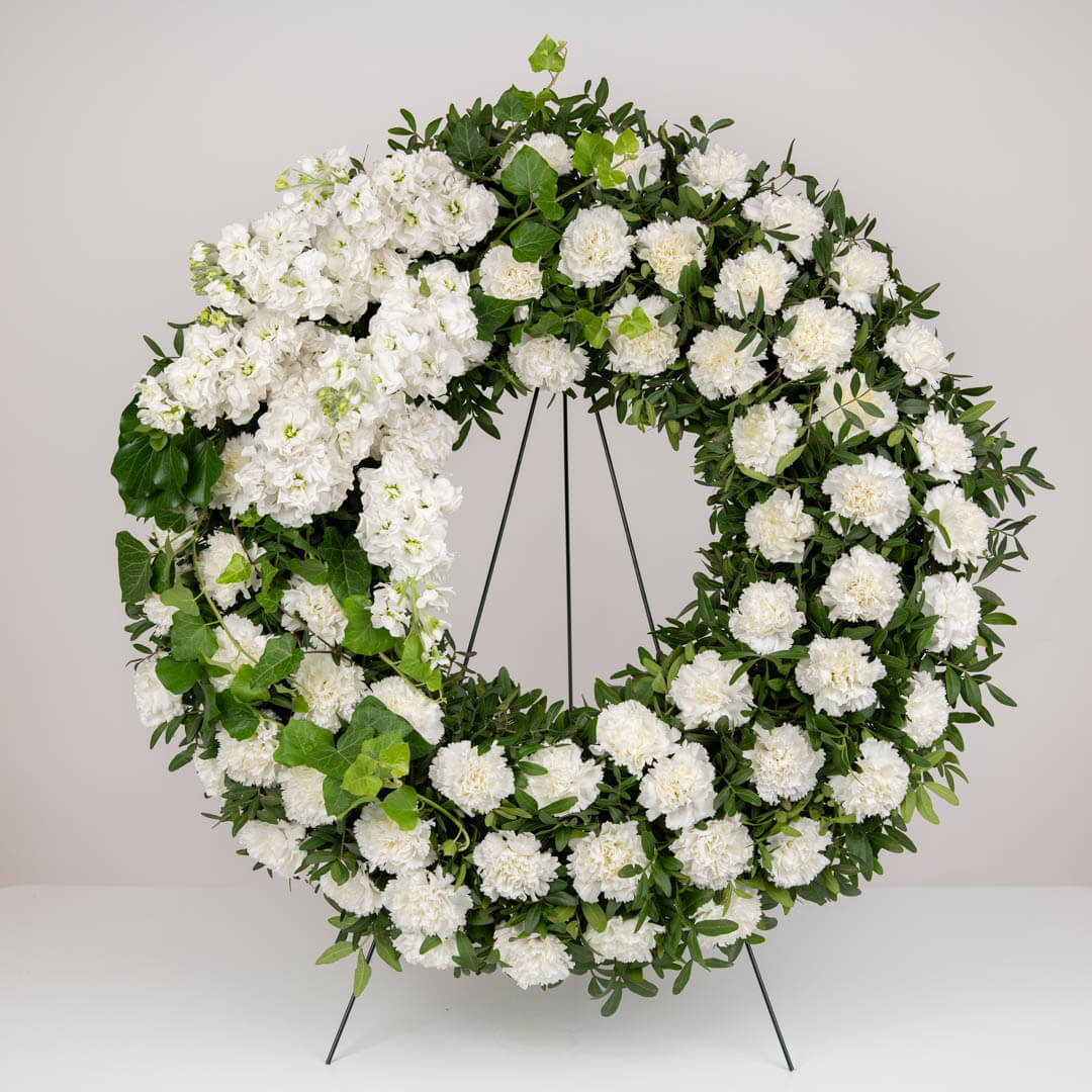 Funeral wreath with matthiola and white carnations