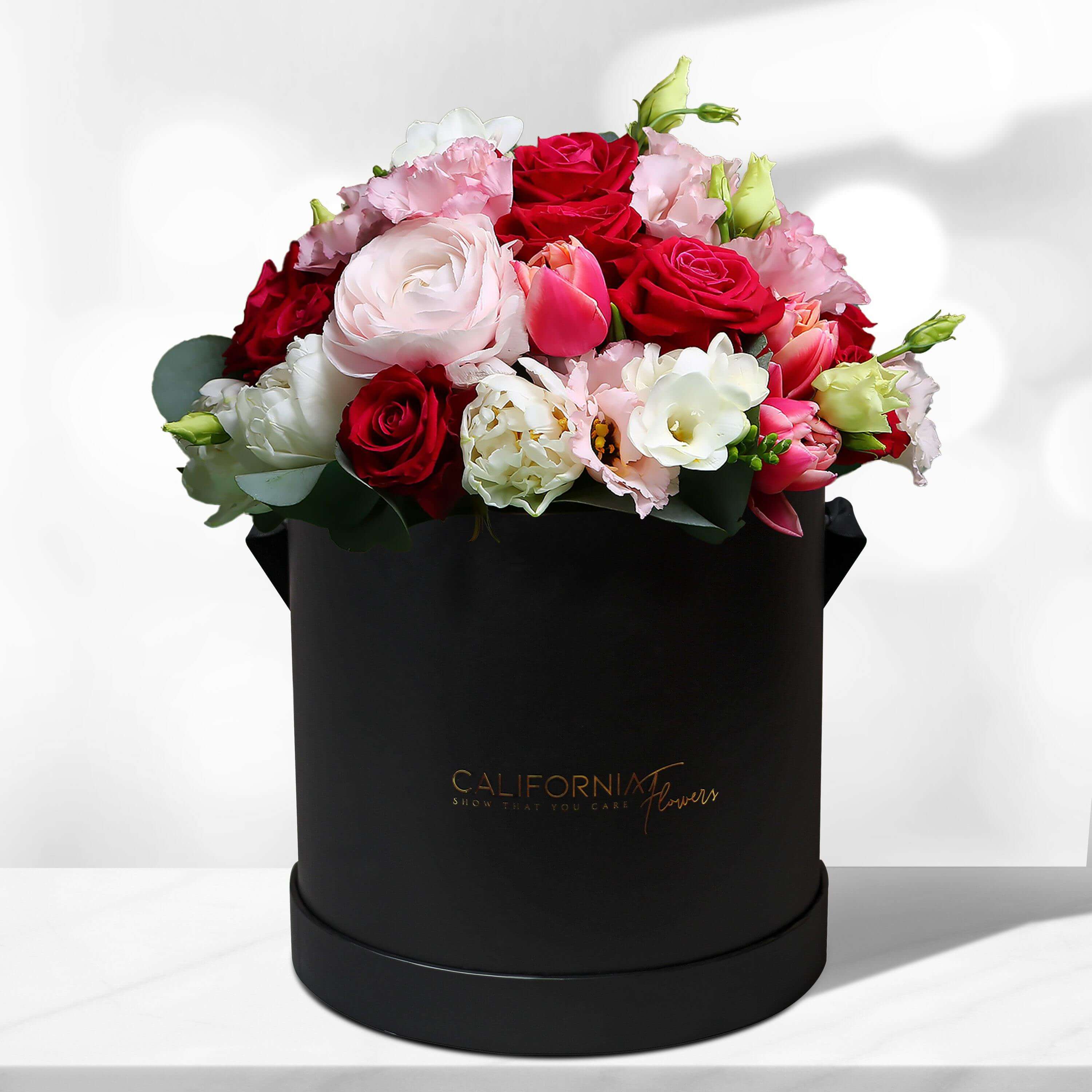 Box with roses, tros and lisianthus