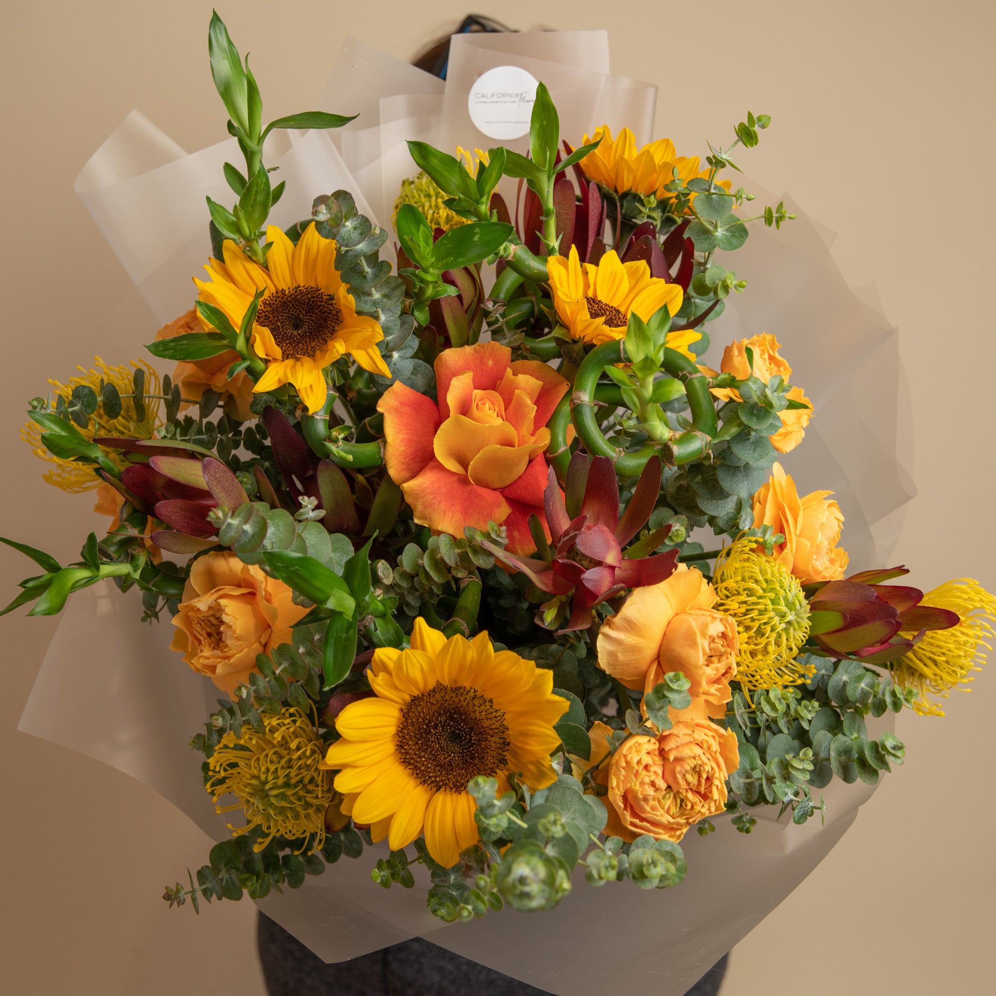 Exotic bouquet with bamboo and sunflowers