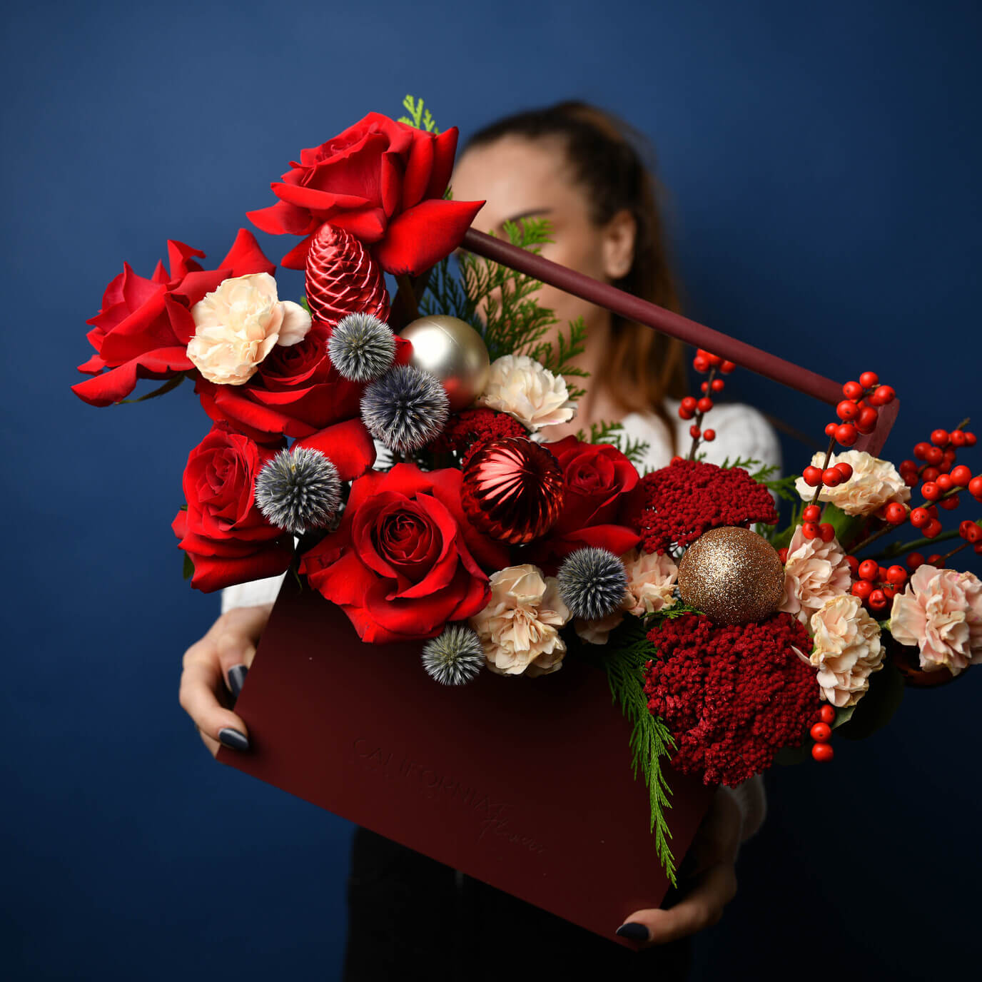 Christmas arrangement with red roses