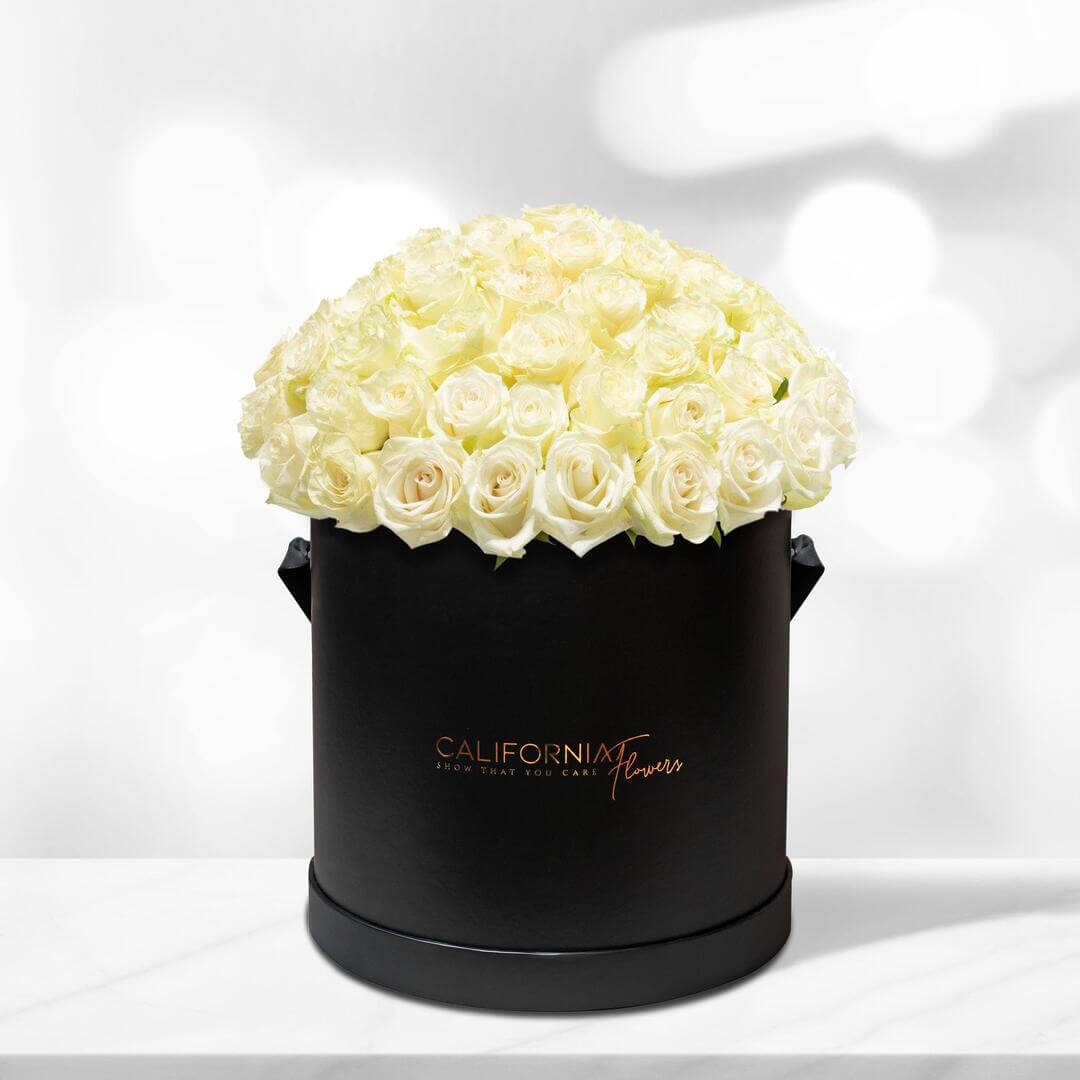 Black box with 63-65 white roses