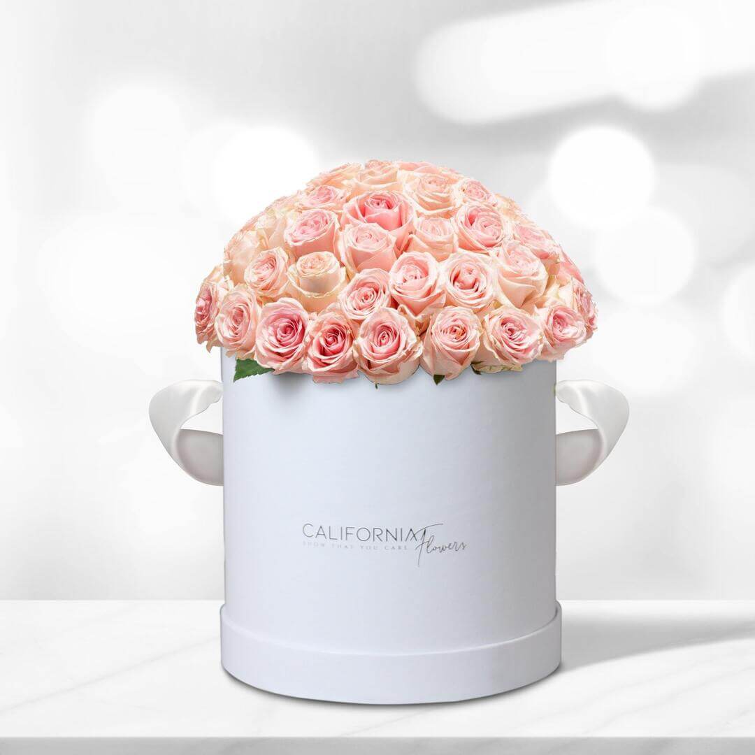 White box with 63-65 pink roses
