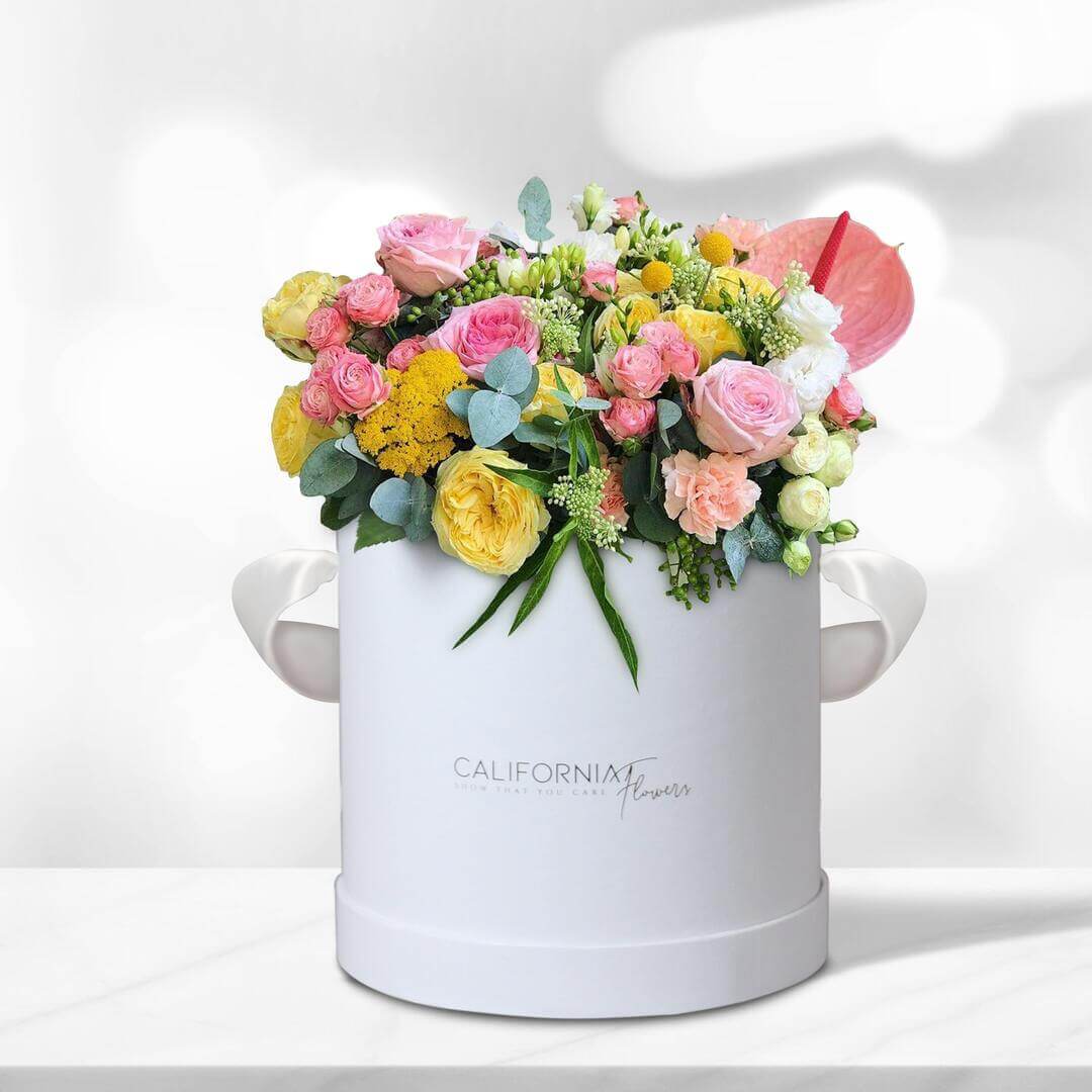 Box with colored roses and anthurium