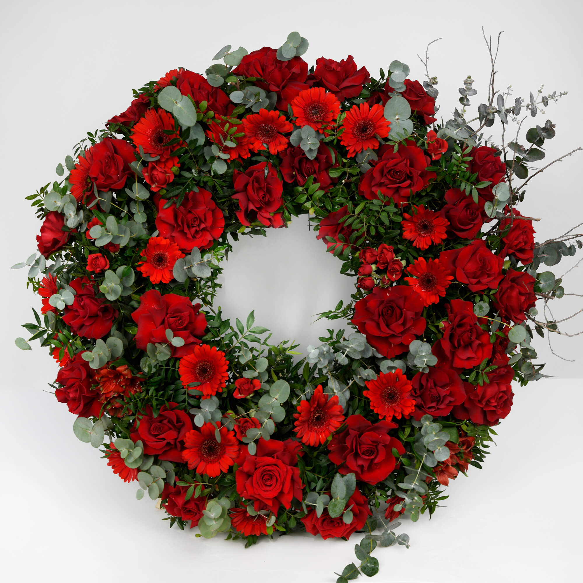Funeral wreath with red roses and gerbera