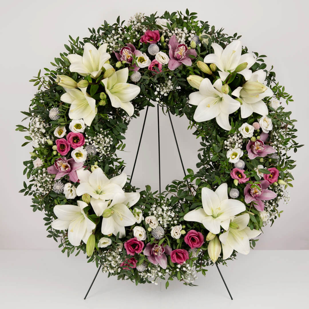 Funeral wreath with lilies, lisianthus and gypsophila