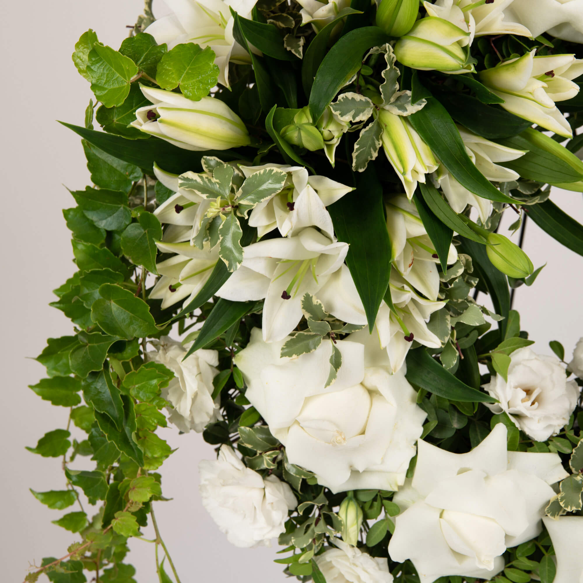 Funeral wreath with lilies and ivy