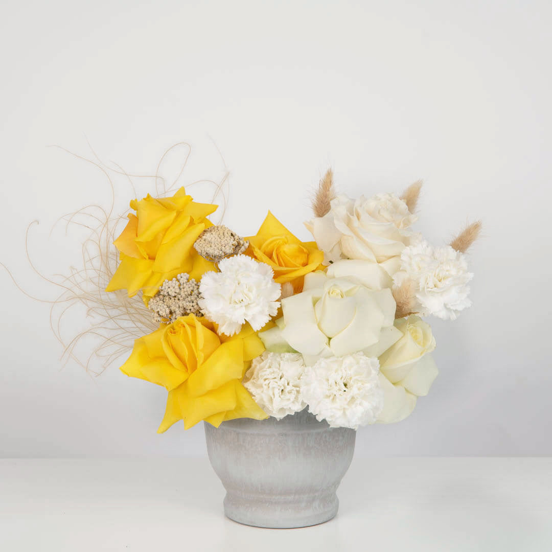 Arrangement with white and yellow roses