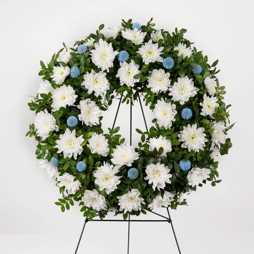 Funeral wreath with chrysanthemums and aspidistra