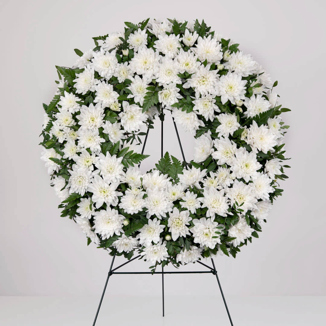 Funeral wreath with chrysanthemums and pistachios 