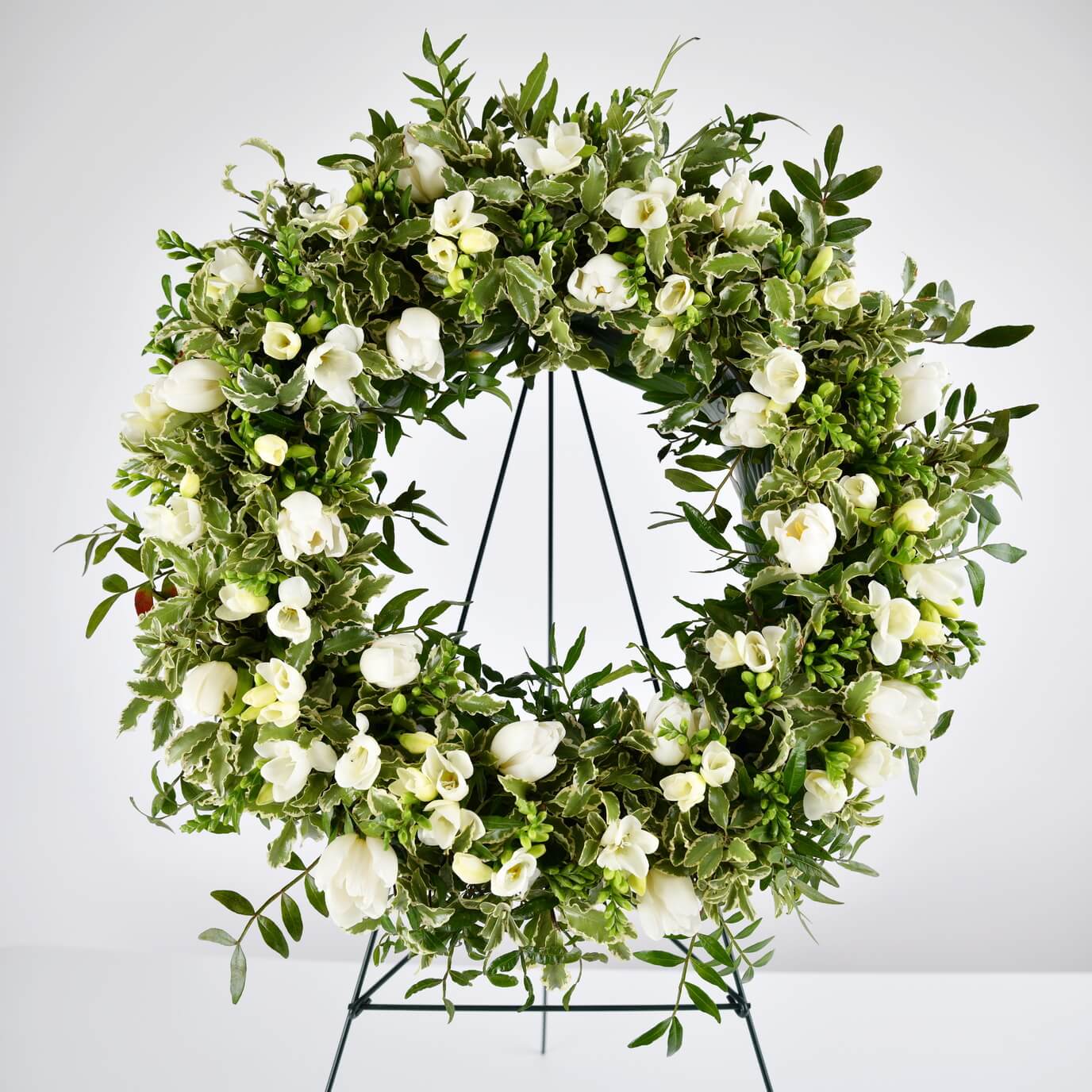 Wreath with tulips and white freesias