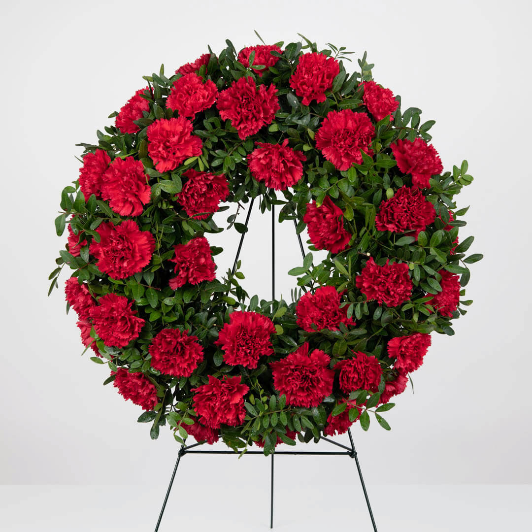 Funeral wreath with red carnations