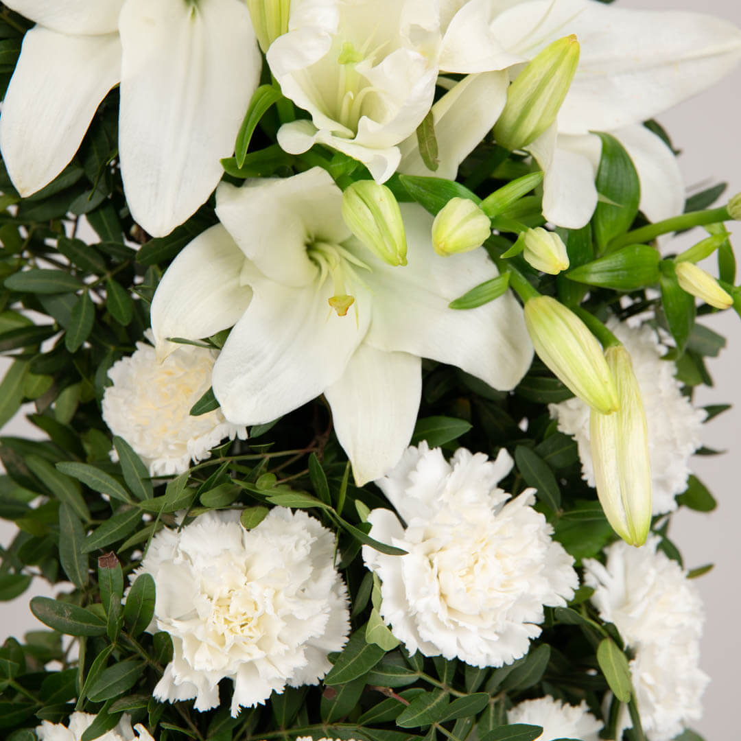 Funeral wreath with lilies and carnations