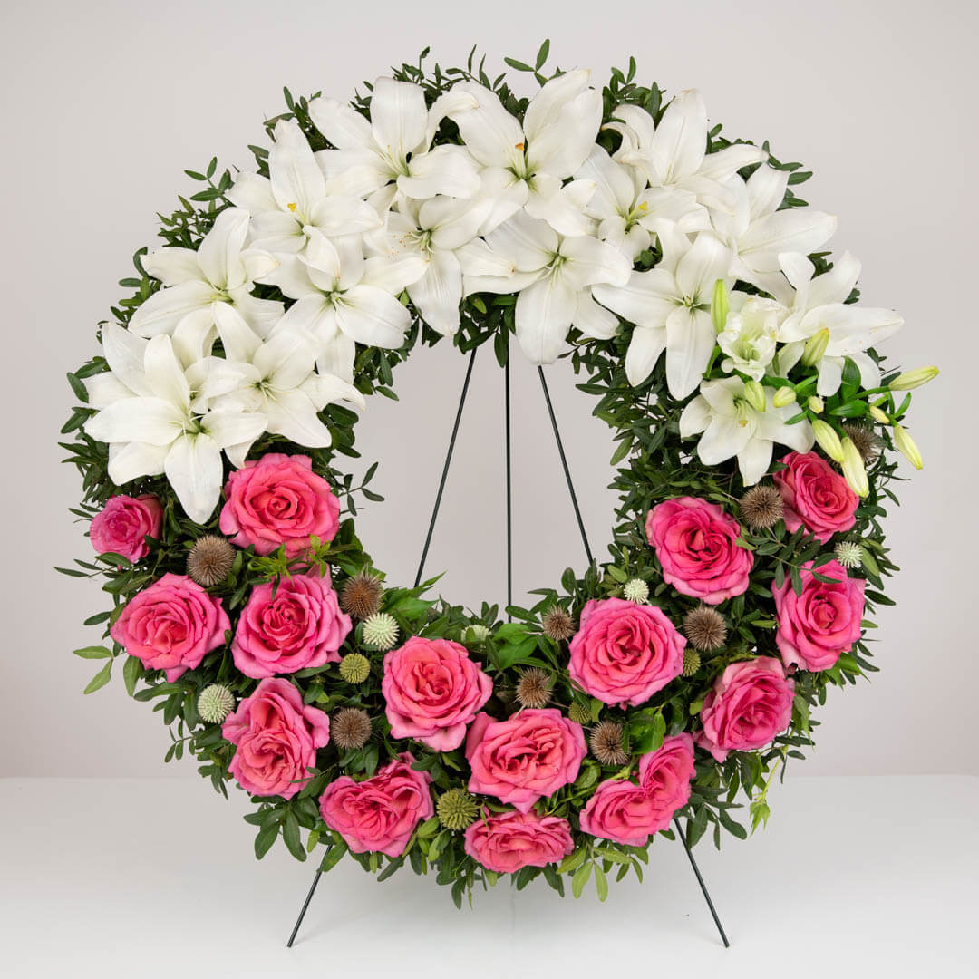 Funeral wreath with lilies and roses